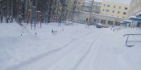 засыпанный снегом двор - ИА Nord-News.Ru